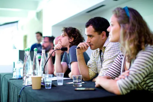 Discussing Fluid Lobbying at Wikimania 2014, by Sebastiaan ter Burg, under CC BY 2.0